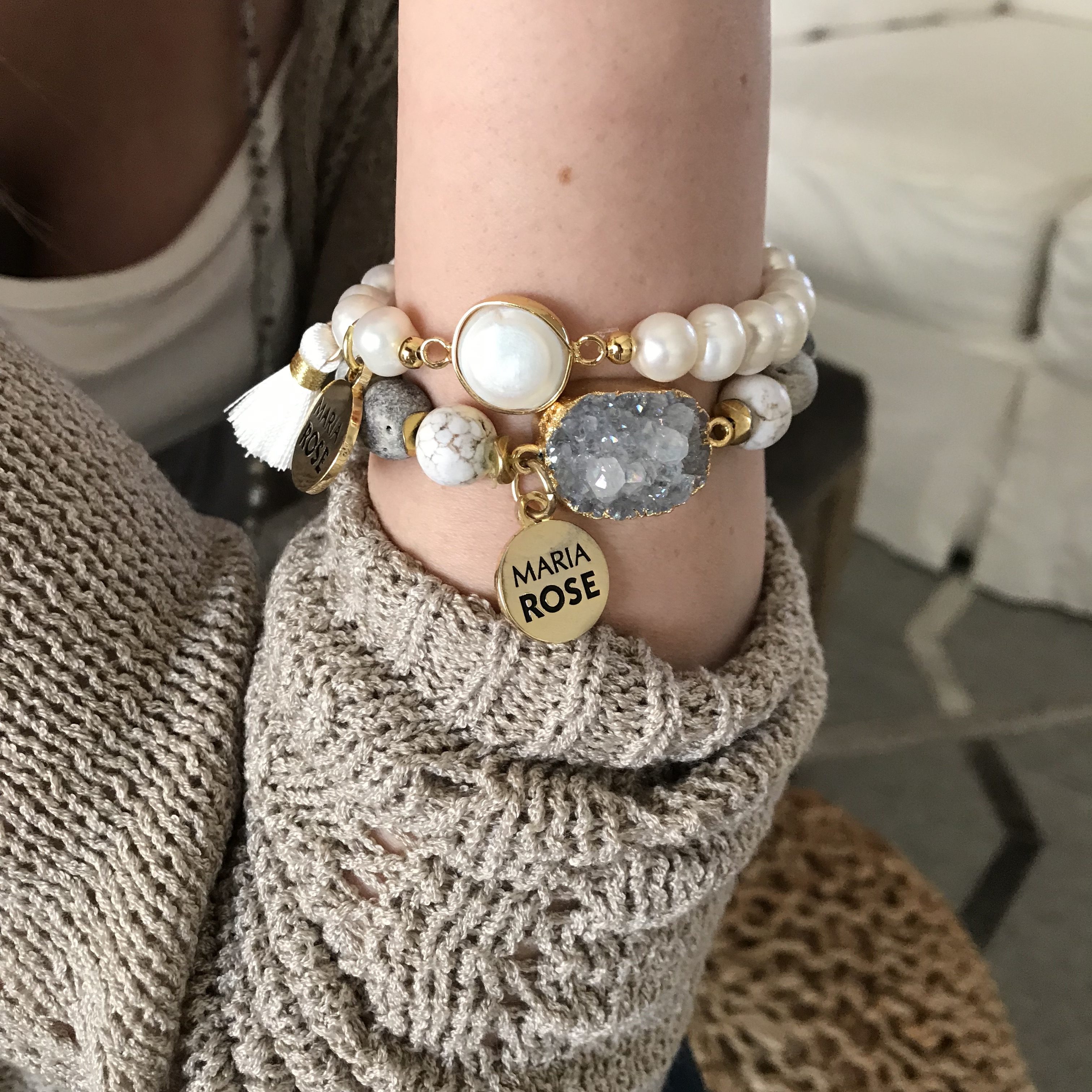 druzy bracelet with pearl bracelet stacked on female arm with gold Maria Rose charm